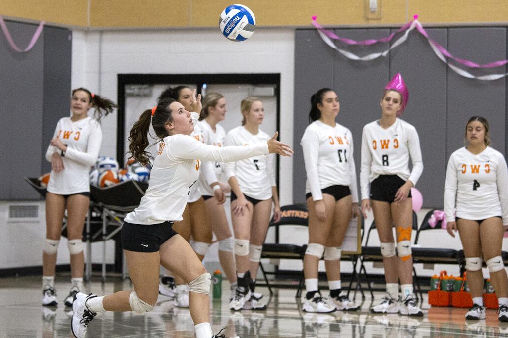 Rustler volleyball player bumps the volleyball